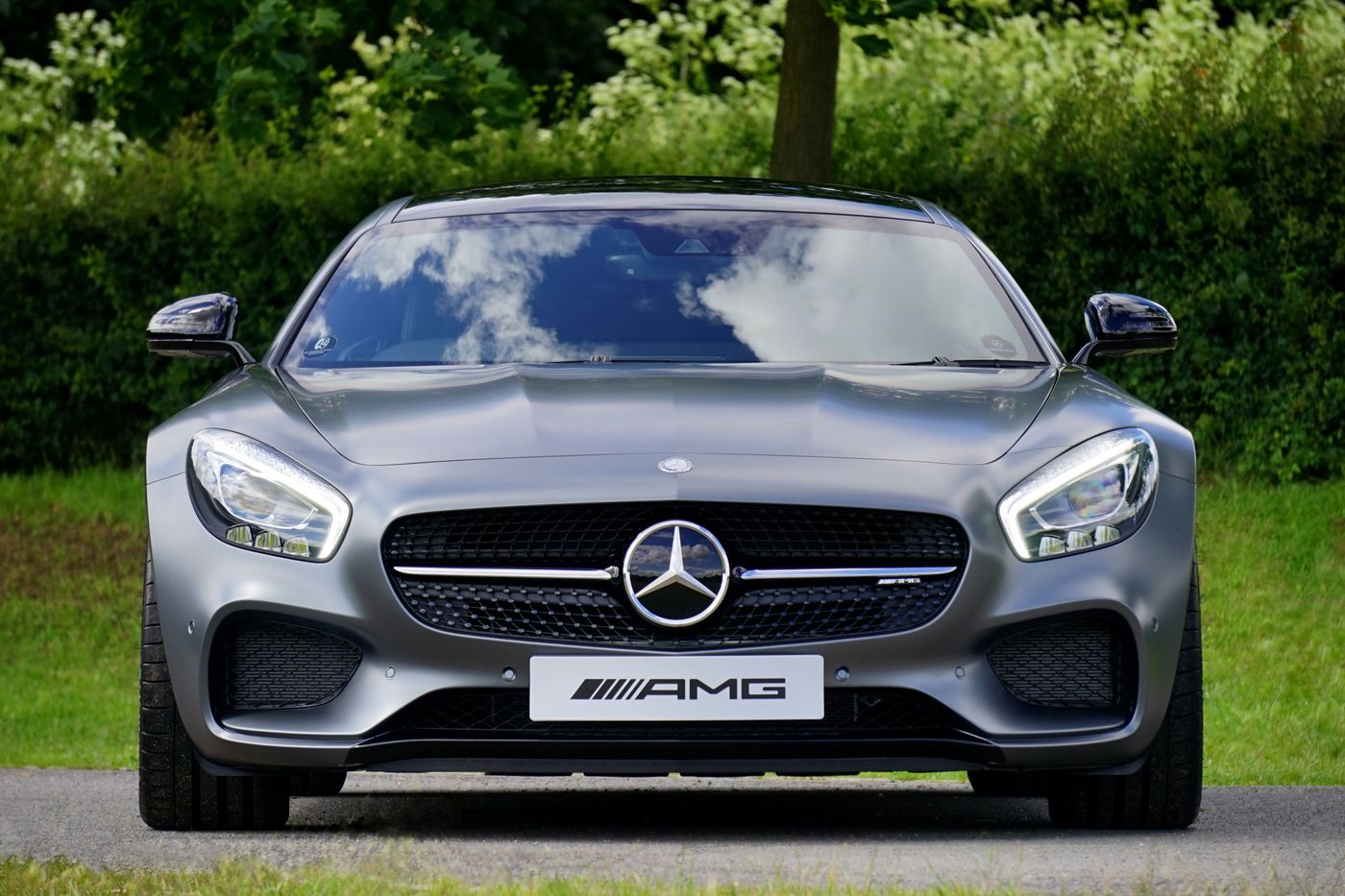 A freshly finished silver car facing the camera