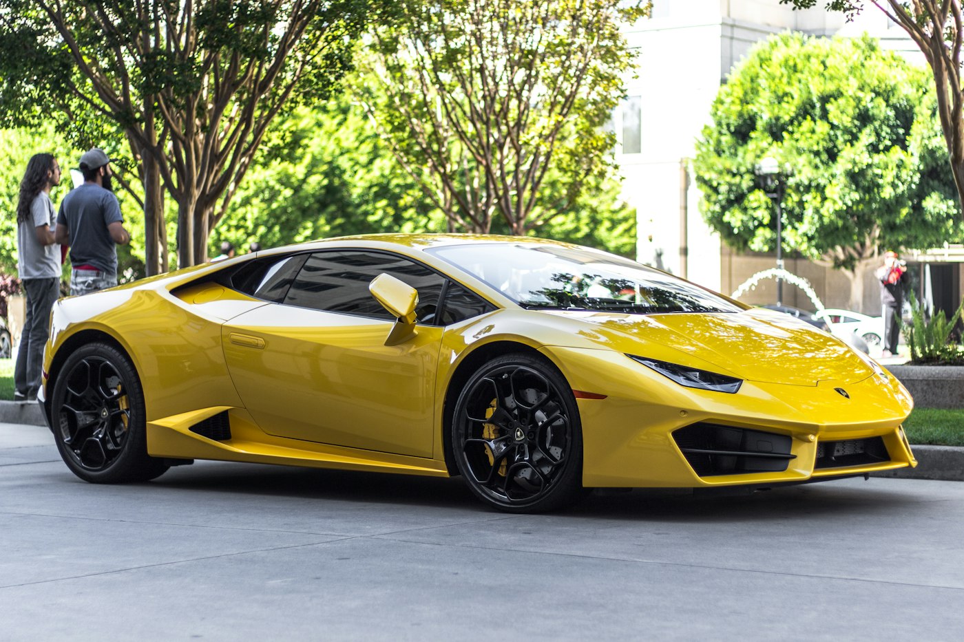 A yellow sports car with a deep shine